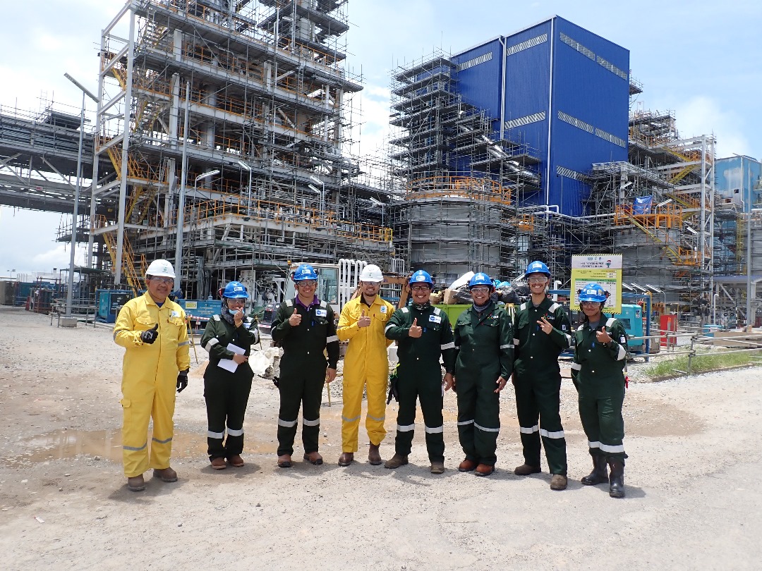 consultants group picture, background of HFE site. performing Human Factor Engineering (HFE) Site Verification at the Petronas Melamine Plant in Gurun, Kedah.